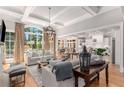 Spacious living room with hardwood floors, high ceilings and views to the backyard at 4545 Whitestone Way, Suwanee, GA 30024