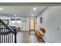 Light-filled entryway, hardwood floors, and built-in bench at 2508 Connally Dr, East Point, GA 30344