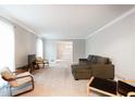 Spacious living room with plush seating and large windows at 790 Oakhaven Dr, Roswell, GA 30075