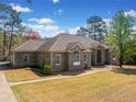 Lovely brick home featuring a well-kept lawn and side entry garage at 19 Spring Lake Trl, White, GA 30184