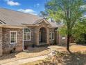Beautiful brick home featuring arched windows and landscaped walkway at 19 Spring Lake Trl, White, GA 30184