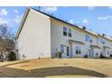 Townhouse backyard with grassy area and a view of neighboring homes at 4658 Grand Central Pkwy, Decatur, GA 30035