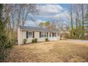 Cozy single story home with charming front yard and driveway, new roof at 3234 Bluebird Ln, Decatur, GA 30032