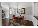 Bright dining room featuring modern chandelier, eye-catching wall art, and table with seating for four at 1634 Ponce De Leon Ne Ave # 503, Atlanta, GA 30307