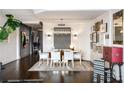 Bright dining room with a modern chandelier and hardwood floors at 2660 Peachtree Rd # 27E, Atlanta, GA 30305