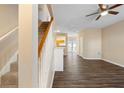 Living room with hardwood floors, a fireplace, and stairs at 3607 Ginnis Sw Dr # 7, Atlanta, GA 30331