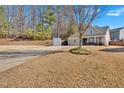 Ranch style home with a tree in front and a large yard at 501 Olympic Way, Acworth, GA 30102