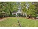 Charming house on a grassy lot with lush trees at 521 E Wesley Ne Rd, Atlanta, GA 30305