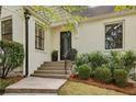 Steps leading to front door, flanked by greenery at 521 E Wesley Ne Rd, Atlanta, GA 30305