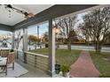 Inviting porch with seating area overlooking a tree-lined street at 679 N Central Ave, Hapeville, GA 30354