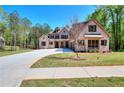 Beautiful two-story brick home with a three-car garage and spacious front yard at 43 Iroquois Ct, Covington, GA 30014