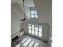 High-ceilinged living room with a fireplace and large windows at 43 Iroquois Ct, Covington, GA 30014