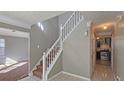 View of stairs and kitchen from entryway at 6108 Waterton Dr, Lithonia, GA 30058