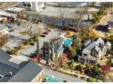 Expansive aerial view of property with pool, manicured grounds, and parking at 3532 S Fulton Ave, Hapeville, GA 30354