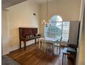 Dining room features hardwood floors and large window at 733 Exchange Mill, Dacula, GA 30019