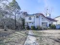 Two-story house with gray siding, walkway, and landscaping in winter at 1699 Paddlewheel Dr, Marietta, GA 30062