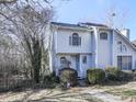 Two-story house with gray siding, walkway, and landscaping at 1699 Paddlewheel Dr, Marietta, GA 30062