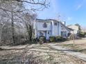 Two-story house with gray siding, walkway, and landscaping at 1699 Paddlewheel Dr, Marietta, GA 30062