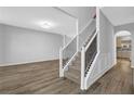 Inviting foyer with staircase, hardwood floors, and neutral paint at 5030 Mundy Dr, Cumming, GA 30028