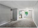 Spacious living room with gray walls and carpeted floors at 516 Fairlane Nw Cir, Atlanta, GA 30331