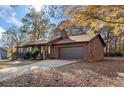 Charming single story home with a long driveway and attached garage at 175 Highland Cir, Mcdonough, GA 30253