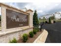 Millcroft community entrance with signage and townhomes at 706 Dodd Ln # 157, Buford, GA 30518