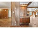 Wood paneled entryway with built-in shelving and flooring at 1265 Glenbrooke Cv, Lawrenceville, GA 30045