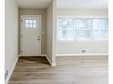 Bright living room featuring new floors, large windows, and neutral paint at 250 Hermer Nw Cir, Atlanta, GA 30311