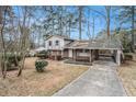 House exterior showcasing a brick facade and a driveway at 3310 Chisholm Sw Trl, Marietta, GA 30060