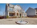 Two-story home with brick and siding, and a manicured lawn at 5015 Montes Ln, Cumming, GA 30040