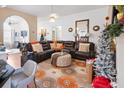 Spacious living room featuring a sectional sofa and decorative rug at 1809 Francon Sw Ct, Conyers, GA 30094