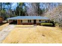 Ranch style home with driveway and yard at 2283 Country Club Sw Ln, Atlanta, GA 30311