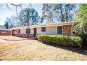 Brick ranch house with a landscaped yard at 2283 Country Club Sw Ln, Atlanta, GA 30311