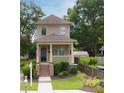 Charming two-story house with a well-manicured lawn at 301 Fortune Ne St, Atlanta, GA 30312