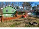 Green house with large deck and spacious backyard at 5912 Jacobs Rd, Acworth, GA 30102