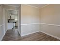 Dining area with hardwood floors and view into kitchen at 1937 Windsor Sw Dr, Atlanta, GA 30311