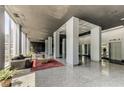 Lobby with seating area, high ceilings, and terrazzo floors at 215 Piedmont Ne Ave # 1707, Atlanta, GA 30308