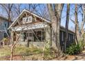 Craftsman home featuring a front porch framed by mature trees and a well-maintained yard at 1316 North Ne Ave, Atlanta, GA 30307