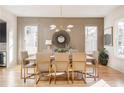 Elegant dining room with a large table and statement light fixture at 17 Rockyford Ne Rd, Atlanta, GA 30317