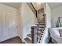 Elegant staircase with dark wood and metal accents at 1934 Asher Ln # 060, Conyers, GA 30013