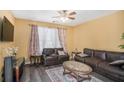 Cozy living room featuring hardwood floors and comfortable seating at 2326 Nicole Dr, Hampton, GA 30228