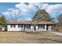 Newly renovated ranch home with a white brick exterior and a large yard at 140 Lake Dr, Fayetteville, GA 30215