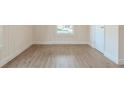 Light-filled bedroom features new paint and luxury vinyl plank flooring throughout at 161 Adair Se Ave, Atlanta, GA 30315