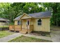 Delightful one-story home with a welcoming front deck and windows, nestled among lush trees at 2064 Chicago Nw Ave, Atlanta, GA 30314