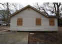 Rear view of renovated cottage, showing new siding at 2064 Chicago Nw Ave, Atlanta, GA 30314