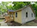 Side view of a quaint one-story home highlighting the new deck and classic architectural details at 2064 Chicago Nw Ave, Atlanta, GA 30314