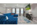 Bright living room with a large sectional sofa and tile floors at 4291 Lamar St, Decatur, GA 30035