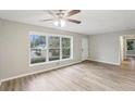 Living room with hardwood floors, large windows, and ceiling fan at 1820 Arkose Dr, Atlanta, GA 30316