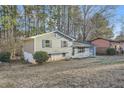 Gray sided ranch home with a landscaped yard and mature trees at 2536 Nw Ridgecrest Dr Nw, Kennesaw, GA 30152