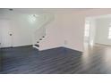 Bright living room with gray vinyl plank flooring at 5055 Promenade Sw Dr, Atlanta, GA 30331